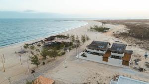 an aerial view of a beach with a building at Villa Vento in Camocim