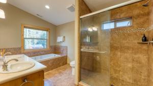 a bathroom with a shower and a sink and a toilet at Washoe Chalet by AvantStay Game Room Hot Tub Putting Green Fire Pit in Tahoma +43 photos