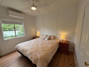 Ένα ή περισσότερα κρεβάτια σε δωμάτιο στο Bunya Cottage