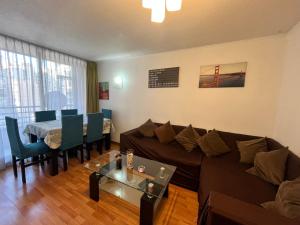 a living room with a couch and a table at Departamento Santiago Centro Full Equipado in Santiago