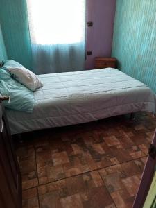 Una cama o camas en una habitación de Casa Azul