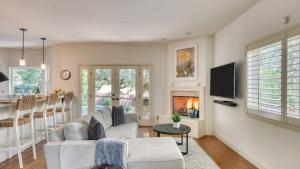 a living room with a couch and a fireplace at Casa Osito by AvantStay Pool Hot Tub Outdoor Dining Minutes from Sonoma Plaza in Sonoma