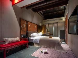 Ένα ή περισσότερα κρεβάτια σε δωμάτιο στο Hutong Mòlì Hotel
