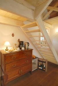 a kitchen with a wooden dresser in a attic at B&B Normanna in Dolceacqua