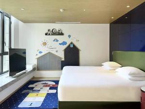 Postel nebo postele na pokoji v ubytování Atour Mansion Shanghai City Center