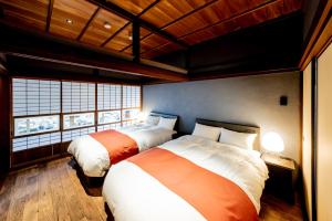 Ένα ή περισσότερα κρεβάτια σε δωμάτιο στο NIPPONIA 美山鶴ヶ岡 Mountain Village