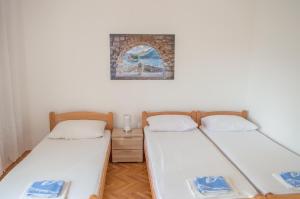 Postel nebo postele na pokoji v ubytování Ranko Apartments