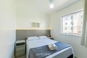 Ένα ή περισσότερα κρεβάτια σε δωμάτιο στο Belo apartamento a menos de 2 min do mar VJG0102 +15 φωτογραφίες