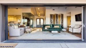 a living room with a couch and a table at Private Pool Firepit Wine Room Near Top Paso Wineries Devi Ranch in Paso Robles