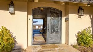 a door to a house with a view of the ocean at Private Pool Firepit Wine Room Near Top Paso Wineries Devi Ranch in Paso Robles +42 photos