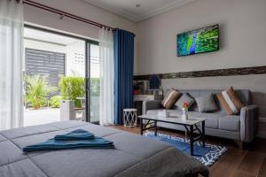 Postel nebo postele na pokoji v ubytování JJs Residence