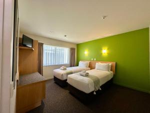 Ένα ή περισσότερα κρεβάτια σε δωμάτιο στο Park View Motor Lodge +26 φωτογραφίες