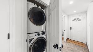 a laundry room with two washer and dryer at Cozy Forest Hideaway in Incline Village Private Balcony Sierra Solace by AvantStay in Incline Village