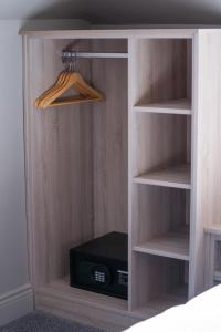 a book shelf with a radio in a bedroom at McCloskeys Residences in Dublin