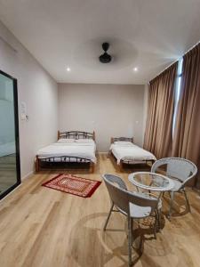 Ένα ή περισσότερα κρεβάτια σε δωμάτιο στο Homestay KNK