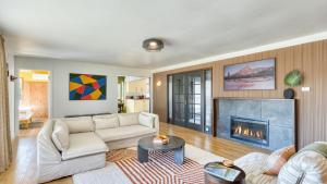 a living room with a couch and a fireplace at Walk to Beach Shops Fireplace Patio Dining Firepit at Manzanita Ave. in Manzanita