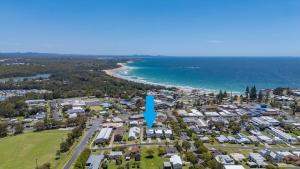 an aerial view of a suburb with a blue arrow at The Cheeky Palm - Beachy, enjoy a cheeky cocktail! in Woolgoolga +25 photos