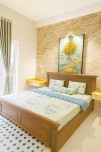 Postel nebo postele na pokoji v ubytování Long Homestay Xuyên Á - Hotels