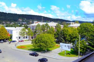 an aerial view of a town with cars parked on the street at Iveria Hotel in Khashuri