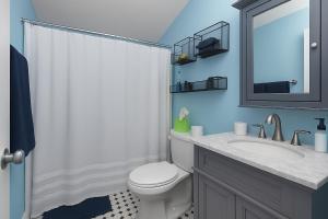 a bathroom with a toilet and a sink and a mirror at Tropical Pool Haven Minutes to Downtown & beaches in Naples +3 photos