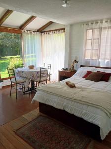 Ένα ή περισσότερα κρεβάτια σε δωμάτιο στο Casa de campo familiar con jardin y asadero