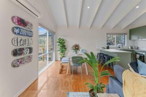 a living room with a couch and a table at The Balcony - pet friendly! in Torquay