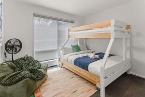 a bedroom with a bunk bed with a cat toy on it at The Balcony - pet friendly! in Torquay