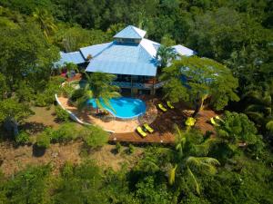 an aerial view of a resort with a swimming pool at Mariposa del Mar Oceanfront villa with private pool in Juticalpa