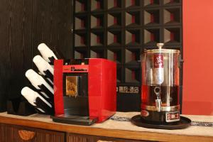 a blender sitting on top of a counter at Beijing TangFu Chinese Culture Boutique Hotel Sanlitun Embassy Area in Beijing +97 photos