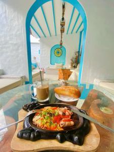 a plate of food on a table with a plate of food at SaoConDor Hotel in Con Dao