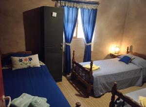 Giường trong phòng chung tại Finca El Legado