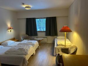 Postel nebo postele na pokoji v ubytování Bjorliheimen Fjellhotell-Hotellrom