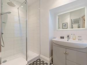 a white bathroom with a sink and a shower at 1 Bed in Richmond oc-88054 in Richmond +32 photos