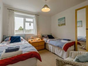 Ένα ή περισσότερα κρεβάτια σε δωμάτιο στο 3 Bed in Bridport oc-dc117