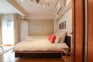 Postel nebo postele na pokoji v ubytování Al Di La 四谷