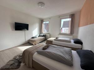 Кровать или кровати в номере Cozy Apartment in The Black Forest