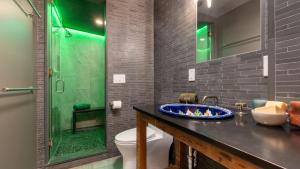 a bathroom with a sink and a shower and a toilet at Modern Catskills Escape w Open Living Steam Shower Hot Tub w Mountain Views Minutes from Woodstock Trails Suncliff Vista in Shokan +25 photos