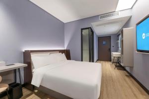 TV a/nebo společenská místnost v ubytování Hanting Hotel Suzhou Gusu Yungu Changjing Subway Station + 11 fotografií