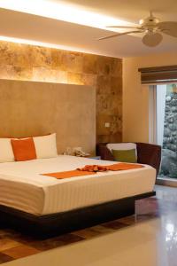 Ένα ή περισσότερα κρεβάτια σε δωμάτιο στο Artisan Playa Esmeralda Family Beach Hotel