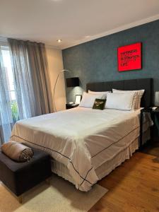 Ένα ή περισσότερα κρεβάτια σε δωμάτιο στο Quarto estilo loft