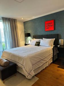 Ένα ή περισσότερα κρεβάτια σε δωμάτιο στο Quarto estilo loft