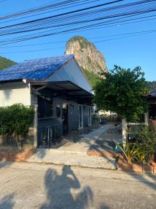 a shadow of a person taking a picture of a mountain at Phunara Guest House in Phatthalung +62 photos