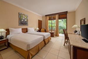 Televiisor ja/või meelelahutuskeskus majutusasutuses The Jayakarta Bali Beach Resort