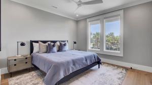 a bedroom with a large bed and a window at 3 47th Avenue by AvantStay Oceanfront Private Pool View in Isle of Palms +68 photos