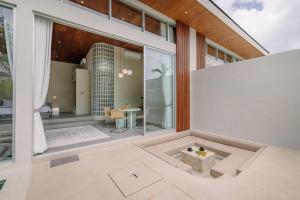 a view of the living room of a house at The Outside Design Suites in Uluwatu