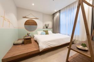 En eller flere senge i et værelse på The Sóng Vũng Tàu Infinity Pool Apartment - Hồ Bơi Vô Cực - Tháp Tam Thắng