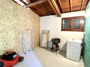 a laundry room with a washing machine and a washer at Charmante maison entre Port Tudy et le Bourg à Groix - FR-1-813-34 in Groix +5 photos