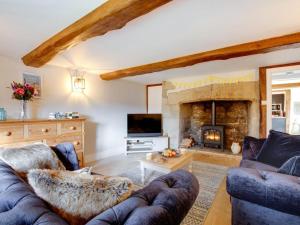 a living room with two couches and a fireplace at 3 Bed in Ventnor oc-93697 in Niton