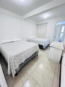 Postel nebo postele na pokoji v ubytování Hotel Julián Cotuc