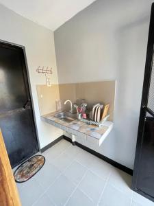 a kitchen with a sink and a counter at ACA Transient House in Nasugbu
